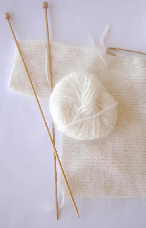 Angora wool may be harvested from French angora rabbits to create a soft, silky yarn.
