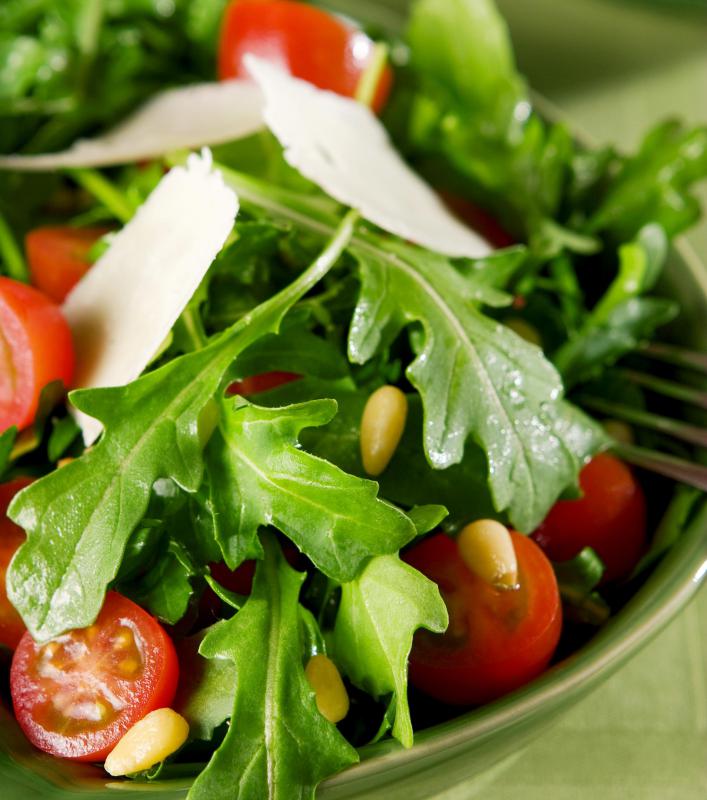 A salad containing cherry tomatoes, which are toxic to pets.