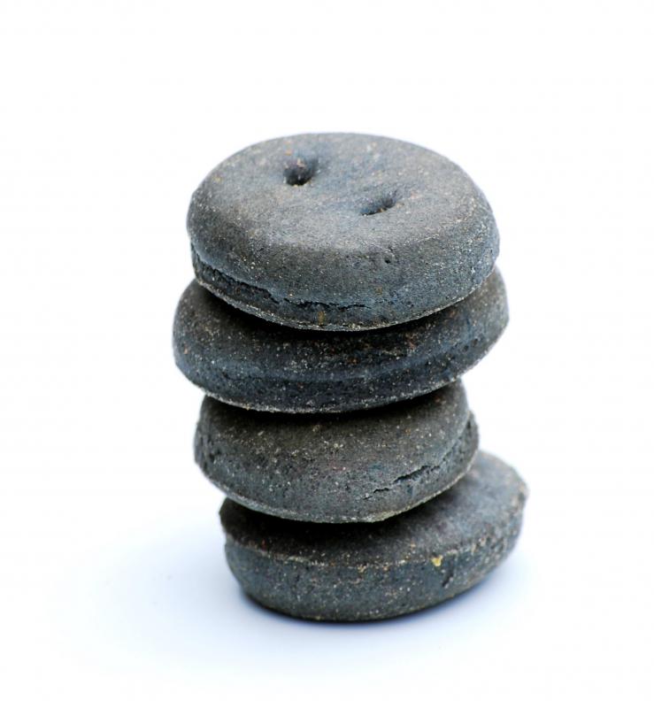 Giving a dog hard biscuits may help clean a dog's teeth.