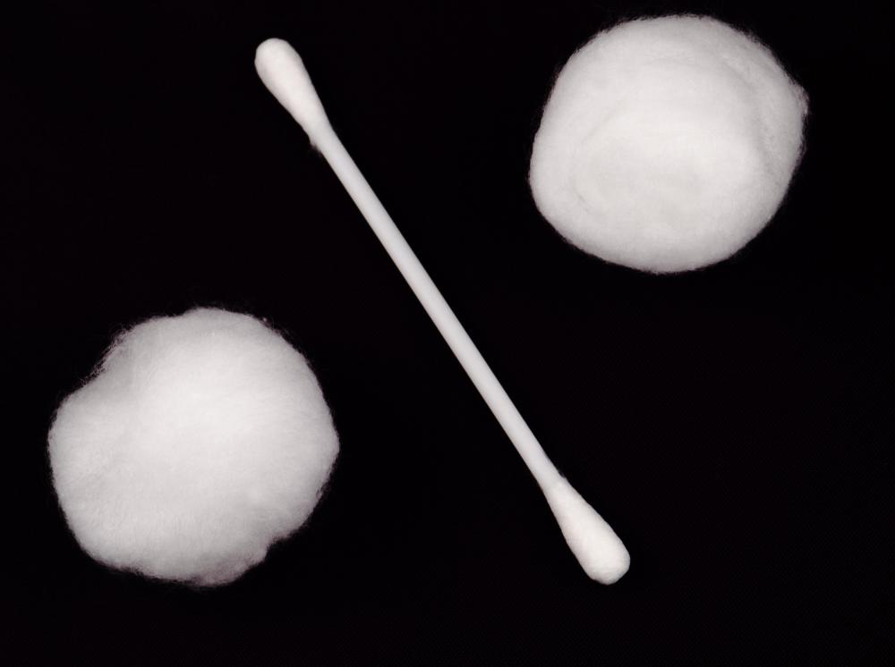 A cotton ball should be soaked in hydrogen peroxide to clean an area that has been affected by porcupine quills.