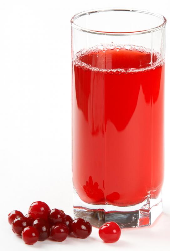 Cranberries (shown here with a glass of juice) are often grown in bogs.