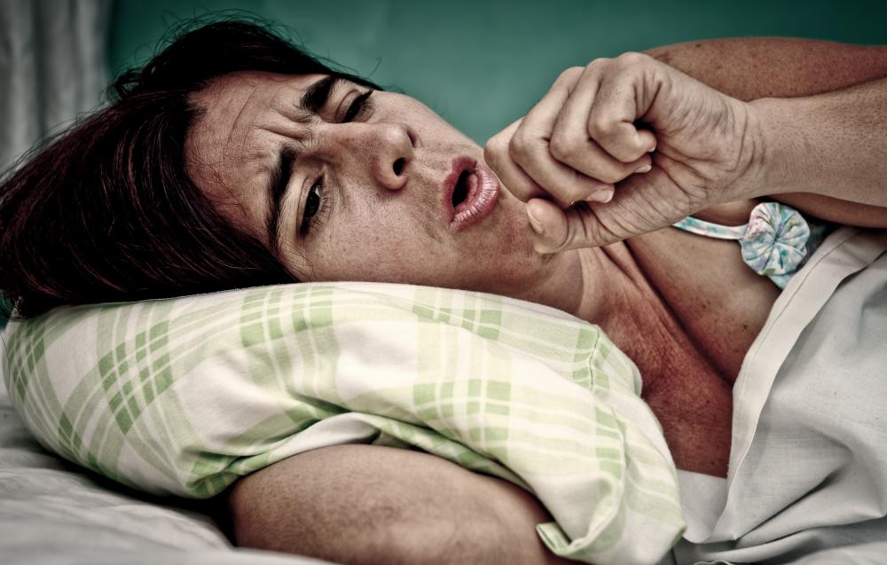 Symptoms of tuberculosis may include fatigue and coughing.