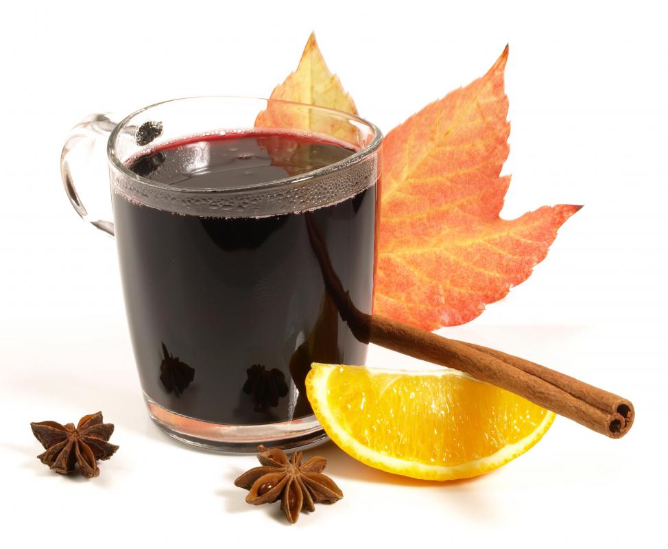 Mulled wine with a fall maple leaf.
