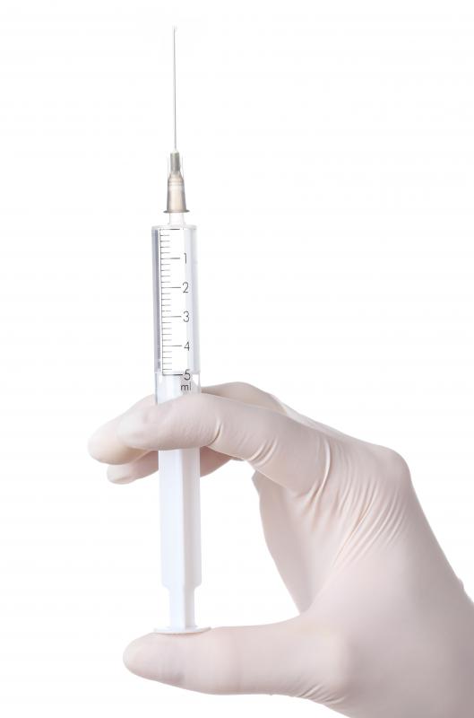 A syringe is used to inject some core vaccines.