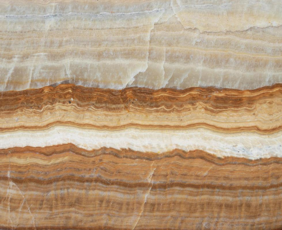 Slate, a type of metamorphic rock, is formed from shale that has undergone high pressure in the Earth's crust.