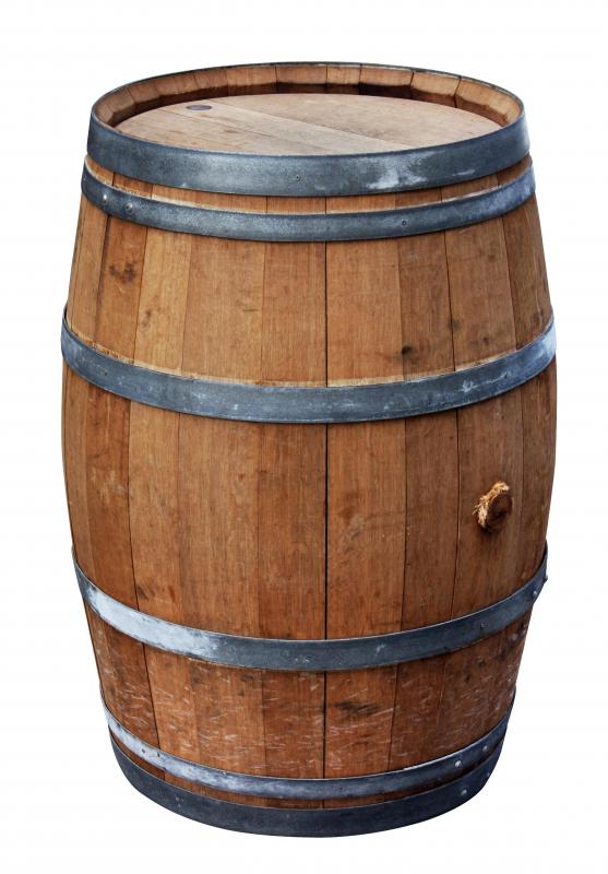 A wooden barrel can be used to collect rain to water plants.