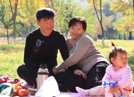 The green space inside an urban park can be an ideal place for a family picnic.