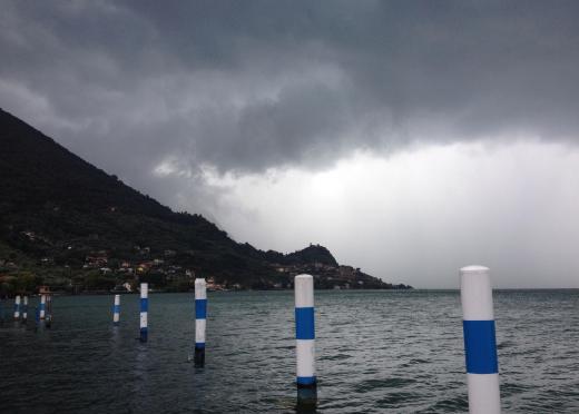 Sulfur dioxide gas floats up in the air and mixes with the droplets of water in rain clouds.