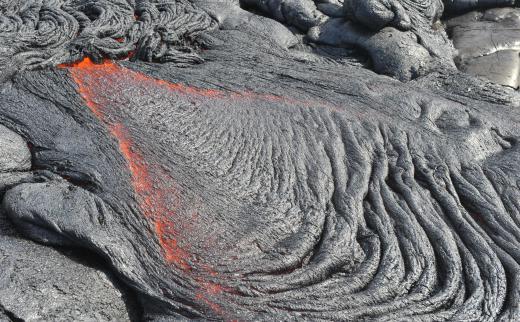 Volcanic craters are typically formed by the gradual build-up of lava flows.