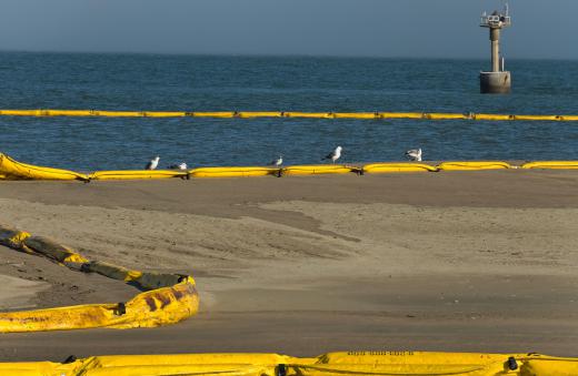 Oil booms being used to limit the spread of an oil spill in the ocean.