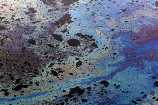 Oil that leaks from cars can be rinsed off a parking lot during a rainstorm, polluting nearby water.